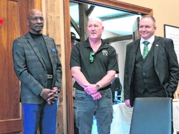 From left is former Mayor Howard Burrell, Chris Dowling and Mayor Anthony Rossi.