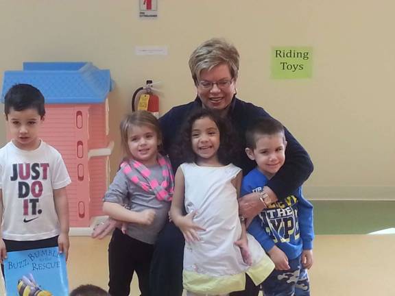 Sparta realtor Julie Killen with the students at the Little Sprouts Early Learning Center.