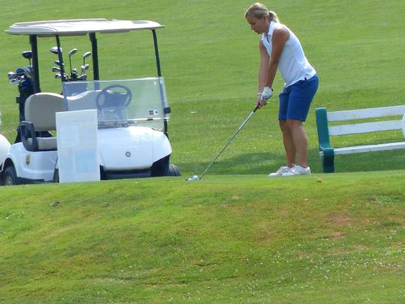 K.E.E.P. accepting golf outing registration Jennifer Gardner from the Sussex County YMCA tees off during K.E.E.P.'s 20th annual golf outing in 2013.