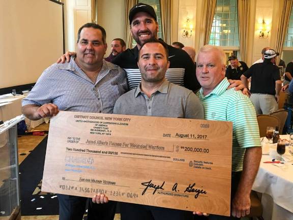 Golf outing at Crystal Springs raises $200K for wounded warrior homes From left, Joseph Geiger, executive secretary-treasurer for the New York City District Council of Carpenters; Jared Allen,  former Minnesota Vikings defensive end and founder of Jared Allen’s Homes for Wounded Warriors; Alex Karalexis, lead project manager for Jared Allen’s Homes for Wounded Warriors; and John Sheehy, chairman for the NYCDCC Charity Golf Outing and director of jurisdiction, contracts and agreements.