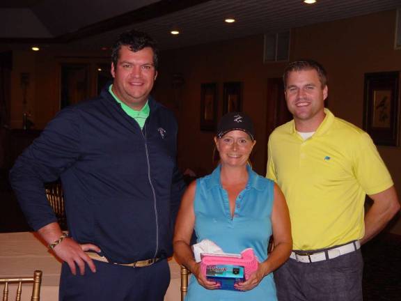 Women&#x2019;s Division Champion Dona Wallerius receives her prize from Crystal Springs&#x2019; Event Coordinator James Fox &amp; GM Dan Hintzen