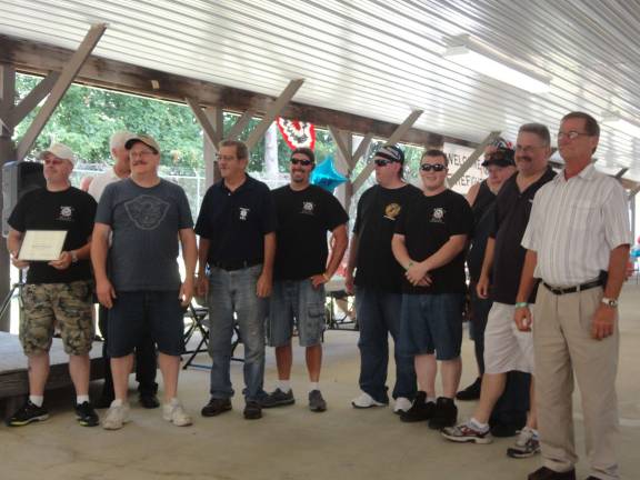 Fire victims host luncheon to honor firefighters Members of the Hamburg Borough Fire Department accept citations of merit for their heroism during recent fires. Photo by Scott Baker