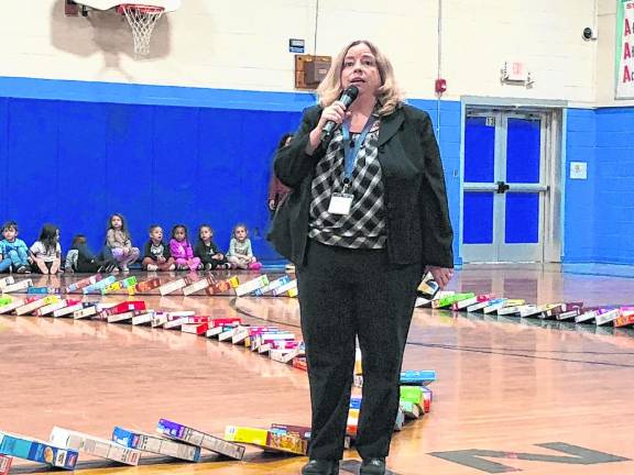 Principal Lisa Vallacchi speaks to students after the program. (Photo by Kathy Shwiff)