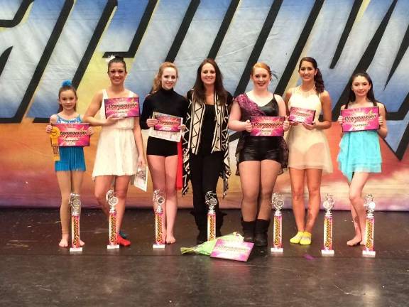 Dream Xtreme competes in competition Shown, from left, are Mya Randell, Sabrina Brooks, Jessica Scherr, Nicole Primo, Samantha McCurry, Arianna Martinez and Heidi VandenHeuvel. Jane Fowler is mossssing from the photo.