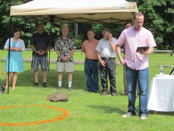 Hamburg church holds tree planting Pastor Bryce Curtis, right, is at the podium with his wife, Kaydee.