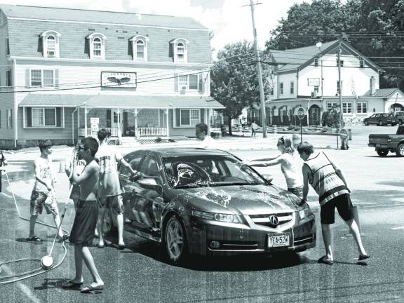 Photo by John Church The Ogdensburgh School class of 2015 recently held a car wash to raise money for their class formal and trip. Class parent Tracy Mueller said they washed 25 cars.