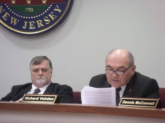 Sussex County Freeholder Richard Vohden (right) speaks before voting last month to approve a multi-million dollar settlement over SunLight General Capital's solar power project. To his left is Board of Freeholders Director Phil Crabb. Photo by Nathan Mayberg