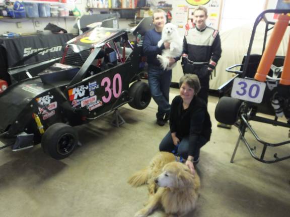 A need for speed Smith with parents Ray and Deena and pets Rascal (Golden Retriever) and Snowball (American Eskimo) at their home.