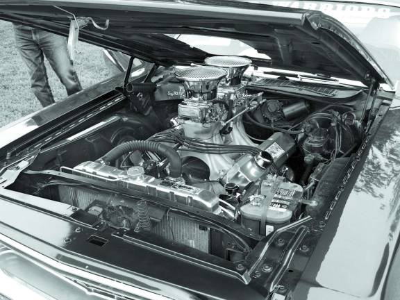 Car Warriors enjoy the fruits of their labor The formidable Hemi engine takes 114 octane gasoline.