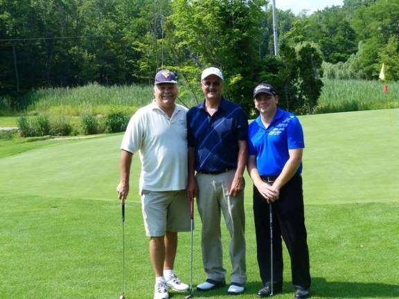 K.E.E.P. raises $25,000 at golf event Golfers pose during the outing.