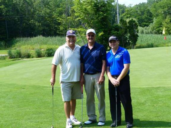 Golfers pose during the outing.