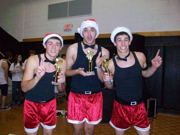 Kodie Hilbert, Mikey Rillo, Brenden Meyer show off their &#x201c;team uniform&#x201d; as they win the 3-on-3 basketball tournament for the second year in a row.