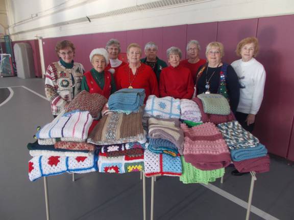 Hardyston seniors make blanket donation Photo courtesy Ray Hatke Pictured, from left with the afghans, are: Gloria Loops, Barbara Hatke, Lorraine Scott,Doris Park, Chris Begley, Helen Turosky, Carol Villalobos, Marianne Cusa, and Joan Missbrenner.