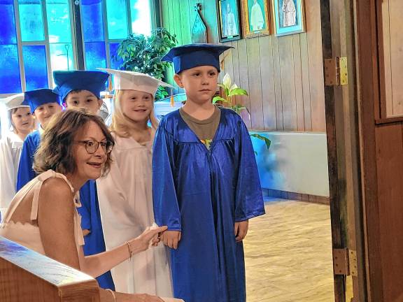 Preschool’s last graduation PR1 Hunter Rios, 5, is the next Our Savior Nursery School graduate to walk into the ceremony June 6. (Photos by Theresa Esposito)