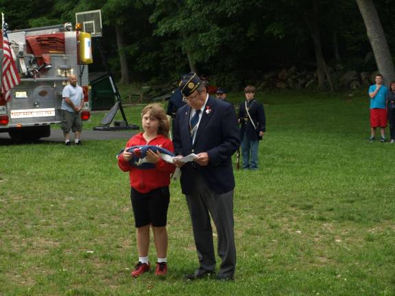 Logan Murphy of Hardyston, and Legion member John Kopcso of Franklin with the first flag to be burned.