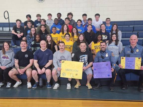 Students, staff and Hardyston police officers pose after the volleyball game.