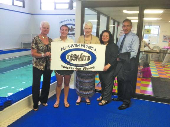 New businesses welcomed in Sparta NJSwim – Sparta Pictured: Rosemarie Paolucci of ValPak, Kimberly Bonanno & Kiersten Bonanno of Bella Couture with the store mascot, Bentley, Nancy Trainor of Trainor Financial.