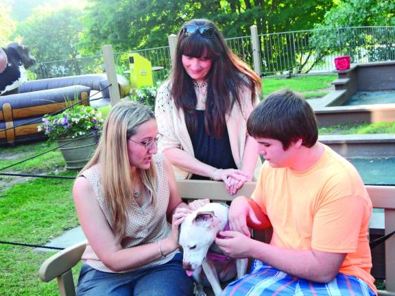 OSCAR's Cassie Kowalchuk, far left, with Mohawk Hose owner Rachael Scro and Dottie with Ryan Gallagher.