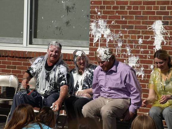 Pies on Pi Day From left, Earl Hornyak, Angela Weigle, Ray DeLear and Michelle Cooper are pie targets Wednesday afternoon at the Ogdensburg School.