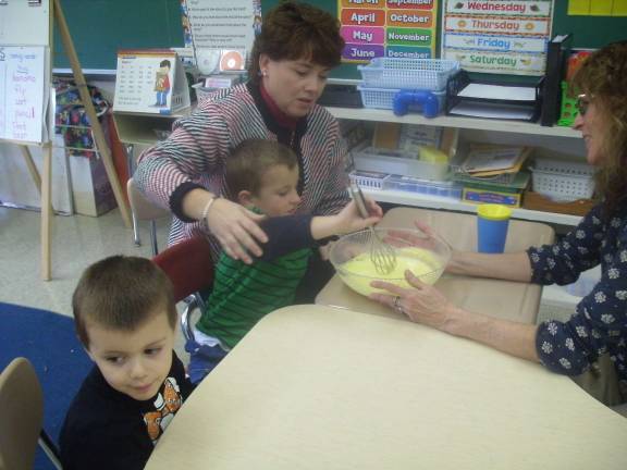 Franklin preschoolers build skills with pudding Anthony Vacante, Drew Babcock, teacher Sharon Wylie and teacher Michle Fuzia are shown.