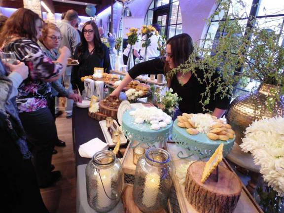 Event celebrates Project Self-Sufficiency Guests mingle and taste at the fundraiser for Project Self-Sufficiency
