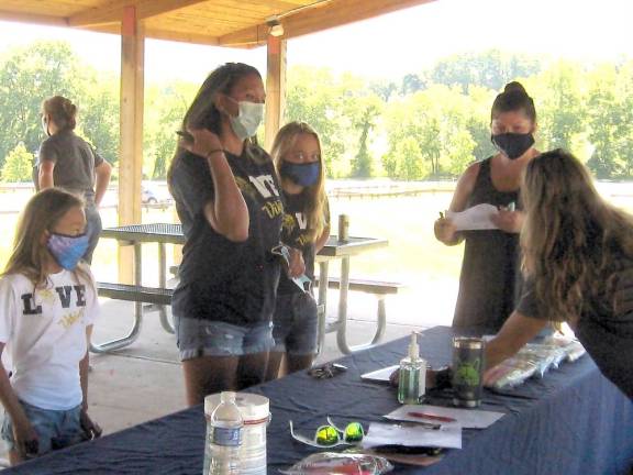 Art Festival participants check in under the pavilion at Maple Grange Park (Photo by Janet Redyke)