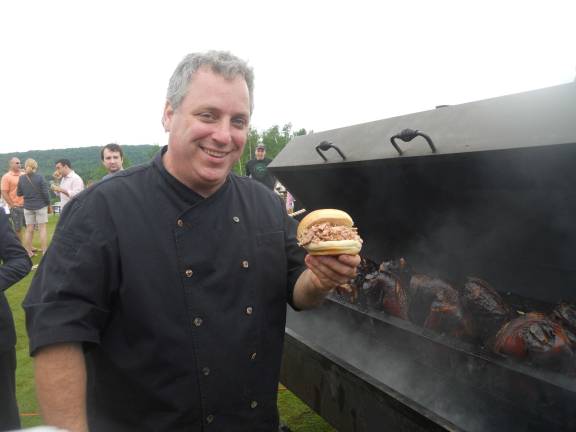 Beer, BBQ and beats Crystal Spring's Executive Chef Tom Greeley with a pulled pork slider served up to patrons.