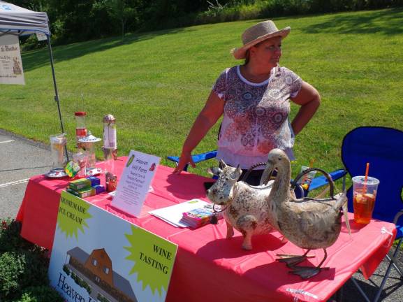 Chamber of Commerce director Barbara Gray of Highland Lakes manned the table for Heaven Hill Farm, while farm employees were busy at their Sweet Corn &amp; Tomato Festival.