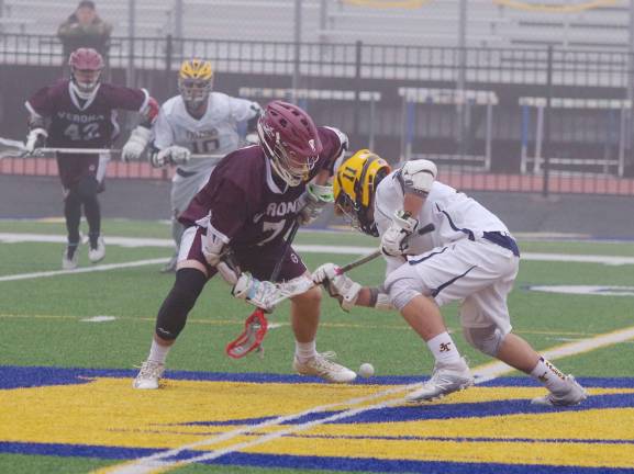 Verona's Michael Stanisci and Jefferson's Hunter Cronk engage in a face-off.