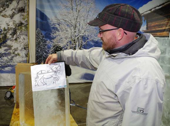 Ice sculptures coming to Skylands Stadium Sculpted Ice Works owner Mark Crouthamel holds the original sketch that later became the frozen horse sculpture.