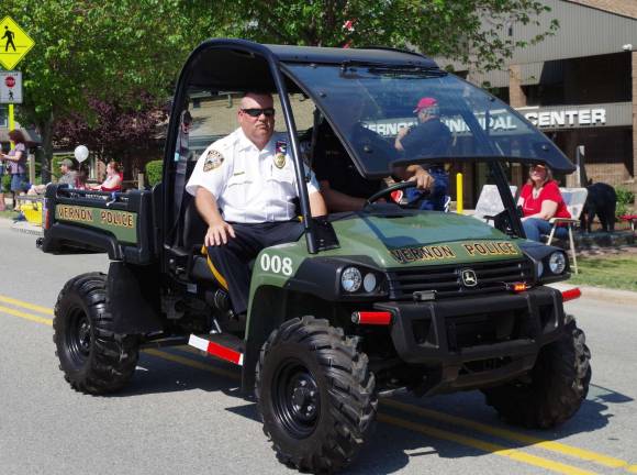 Township’s annual veteran’s tradition continues Near the front of the parade was Vernon Township Police Chief Randy Mills is shown in the departmentþÄôs John Deere Gator Ultimate Terrain Vehicle driven by Lt. Daniel Young.