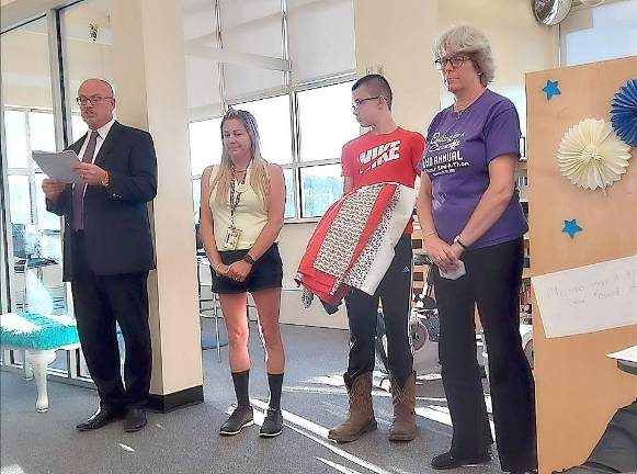 Derek Yannetta, one of the eighth-grade students, attended the Board of Education meeting. Noah Eastburn and Johnny Posser were not present but all three were celebrated at the meeting.