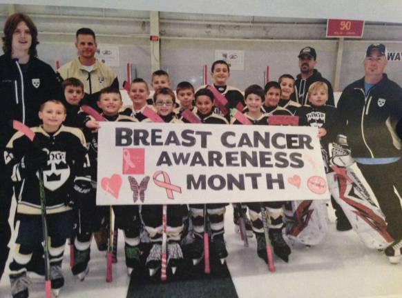 Local hockey team 'skates it forward' October: Breast Cancer Awareness ~ $130 was raised for a local woman battling the disease.