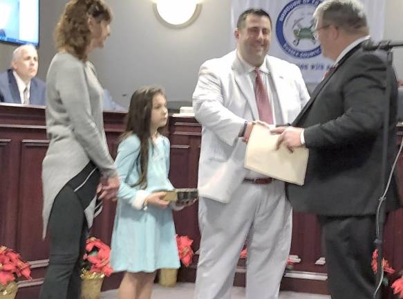 State Sen. Steven Oroho, right, congratulates Councilman Stephen Skellenger after he takes the oath of office. With Skellenger were his mother, Robin, and niece Mila Garrera.