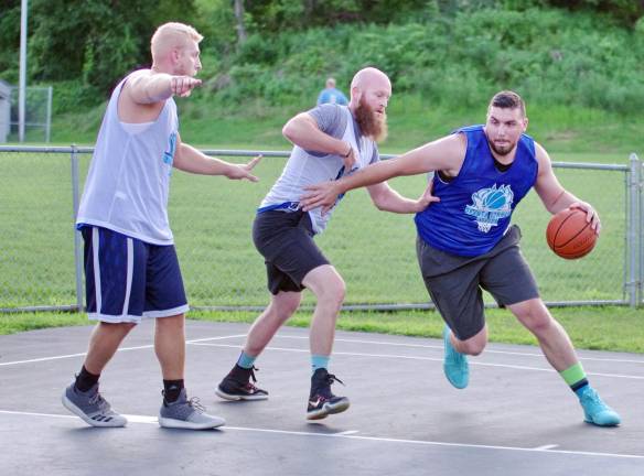 Team Tobin's Elvis Hodzic handles the ball.