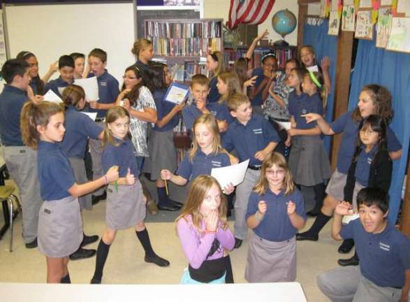 Students in the Forensics Club at Immaculate Conception Regional School in Franklin are seen herepracticing their Halloween skits which will be presented to the younger grades on Halloween.Each year, the Forensics Team participates in two county-wide competitions and also doespresentations within the school for holidays and special occasions. The club consists of students in fourth- through seventh-grades who are interested in public speaking and dramatic interpretations of text.