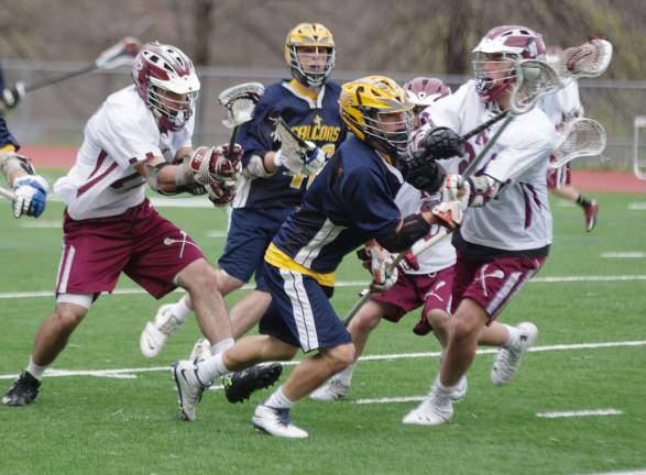 Jefferson Falcon Ray Amsden with the ball in the midst of a maelstrom of lacrosse players.