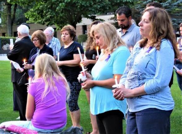 People came together in their collective grief July 25 to pray, to reflect and to begin the healing process, as the small, rural community struggles to process the tragic events of three weeks ago.