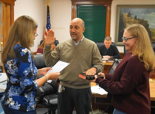 New Ogdensburg mayor takes office From left, Borough Clerk Robin Hough administers the Oath of Office to Councilman David Astor, with Charlotte Gough holding the Bible.