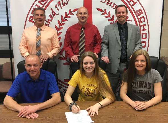 High Point's Emily Mulvoy, seated center, sign her Letter of Intent to continue her basketball career next season at Rowan University. Pictured, seated left to right, are Emily's parents Pat and Amy. Standing from left to right are Athletic Director Todd Van Orden, Head Girl's Basketball Coach Chris Dexter, and Principal Jon Tallamy.