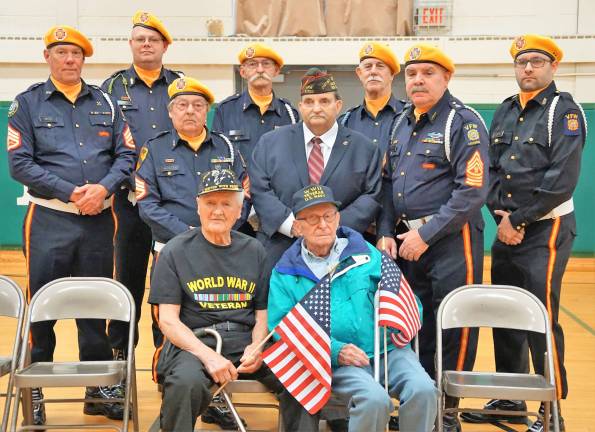 From left, front row, WWII veterans John Hornyak and Stephen Macko sit in front of the VFW Post 10152 Ogdensburg.