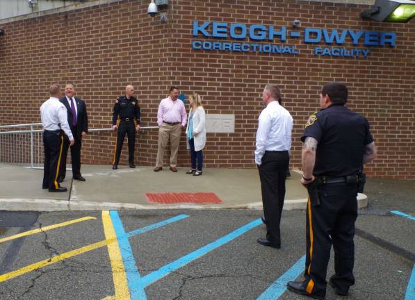 Members of the Sussex County Sheriff&#xfe;&#xc4;&#xf4;s Department and guest visitors wait outside the visitors&#xfe;&#xc4;&#xf4; entrance to the Keogh-Dwyer Correctional Facility last Thursday evening.