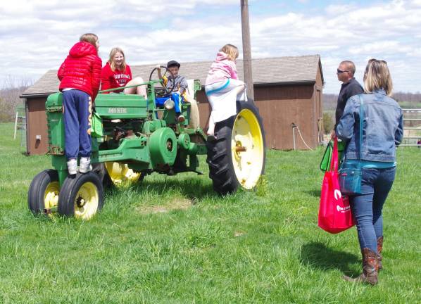 Kids had a chance to explore a farm tractor.
