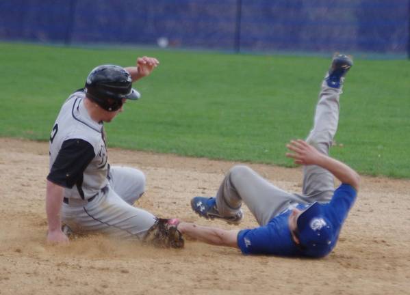 Wallkill Valley's Joe Tizzano slides safe on second base before the tag by tumbling Kittatinny second baseman Dom Maio.