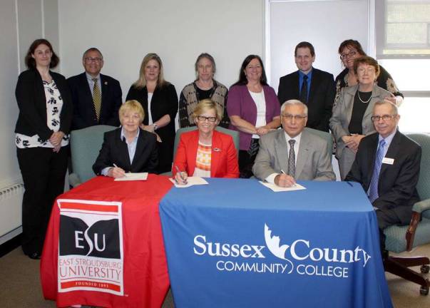 Administrators and faculty members from East Stroudsburg University (ESU) and Sussex County Community College (SCCC) participated in an articulation agreement signing ceremony on May 11 at SCCC. Seated from left to right are: Joanne Zakartha Bruno, J.D., provost and vice president of academic affairs at ESU, Marcia G. Welsh, Ph.D., president of ESU, Paul Mazur, Ph.D., president of SCCC, and William Waite, vice president of academic affairs at SCCC. Standing from left to right are: Candice Pellegrino, assistant registrar for transfer articulation at ESU, Robert Fleischman, J.D., Ed.D., dean of the college of business and management at ESU, Kathleen Okay, dean at SCCC, Naomi Miller, professor of psychology at SCCC, Deborah McFadden, vice president of student affairs at SCCC, Scott Scardena,, transfer counselor at SCCC, Nancy Gallo, professor of legal studies at SCCC, and Alberta Jaeger, associate dean of academic affairs at SCCC.