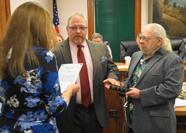 New Ogdensburg mayor takes office PHOTOS BY VERA OLINSKIFrom left, Borough Clerk Robin Hough gives the Oath of Office to Mayor George Hutnick, while his father, George Hutnick, holds the Bible.