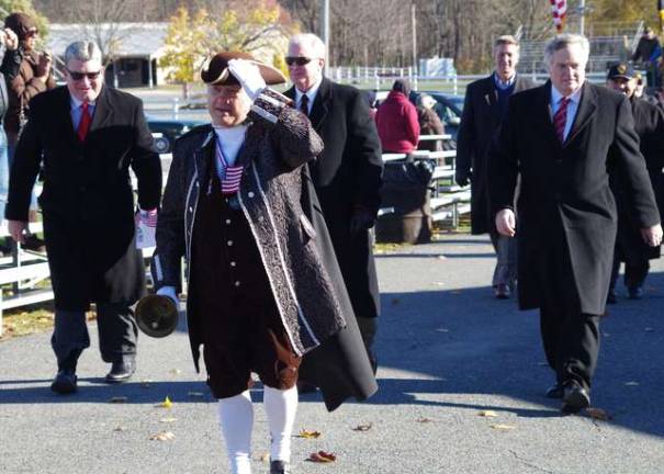 Sussex County Crier William Joseph, a Marine Corp veteran, is followed by state and county officials of Sussex County.