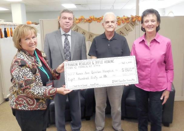 Marlina Schetting, John Quinlan, Bob Uzzalino, and Helen Swingle at Oct. 20 check presentation (Photo provided)