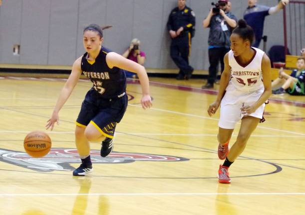 Jefferson's Ashley Hutchinson dribbles the ball as Morristown's Kimberly Calloway keeps pace.