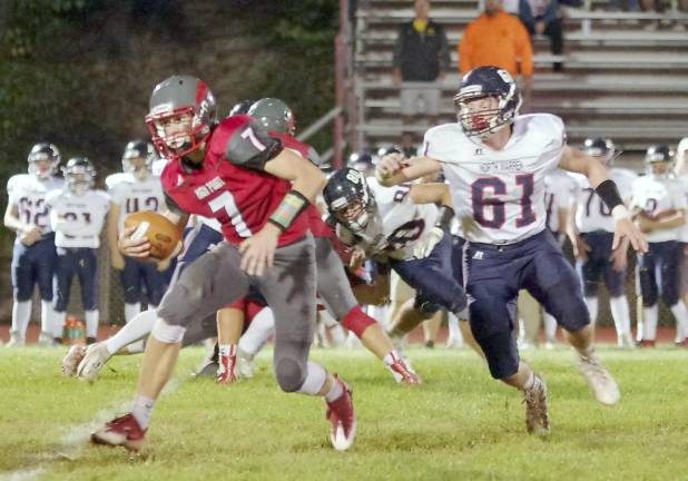 High Point quarterback Alex Buchwald is on the run with the ball in the first half. Buchwald scored a running touchdown and threw a touchdown pass